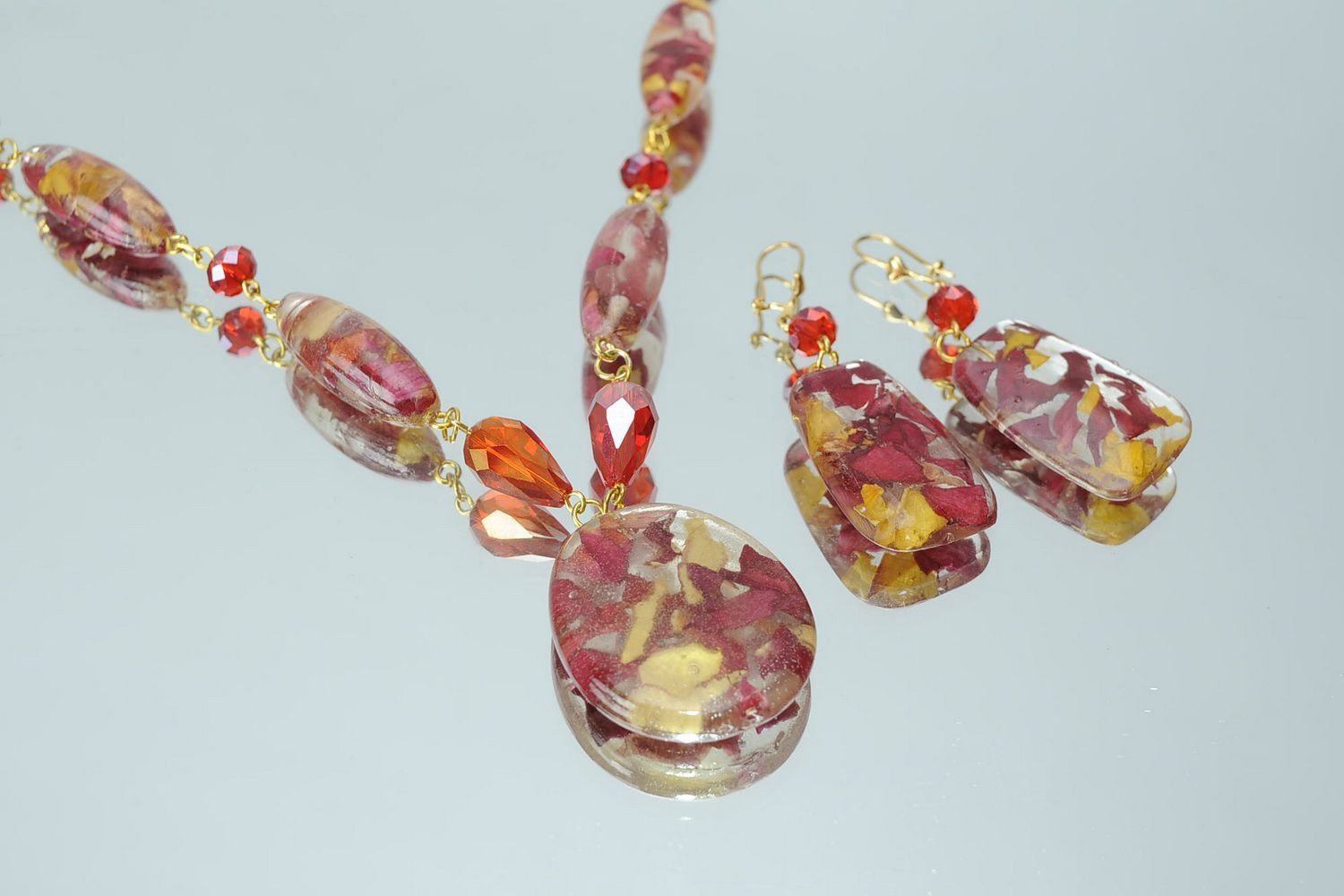 Conjunto de jóias: brincos e pingente Vento roso foto 4