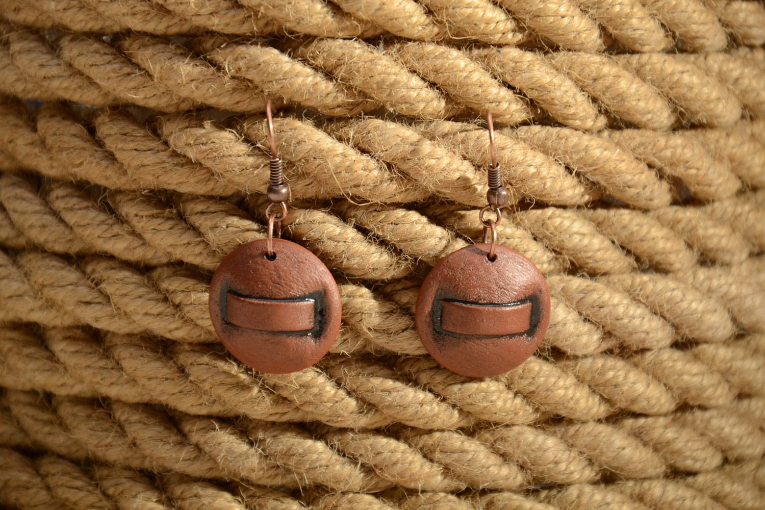Handmade festive brown ceramic dangle earrings of round shape painted with enamel photo 1