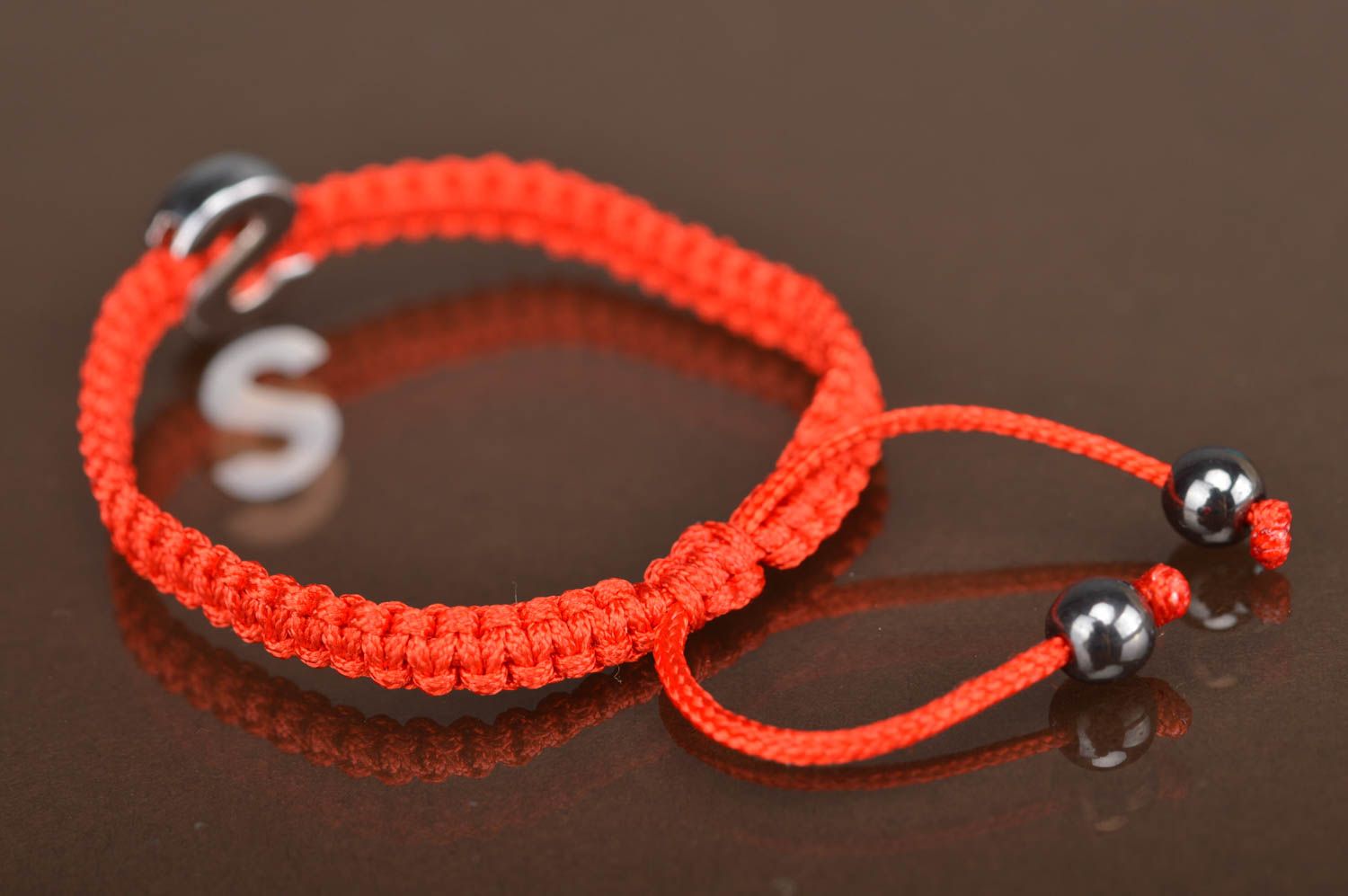 Lovely handmade women's friendship bracelet woven of red threads with letter S photo 5