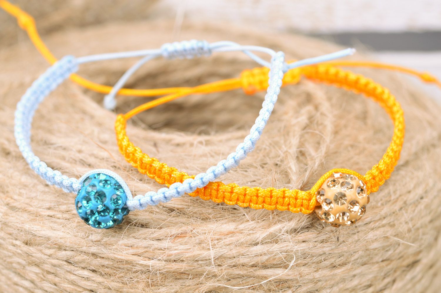 Set of 2 handmade friendship wrist bracelets of yellow and blue colors with beads photo 1