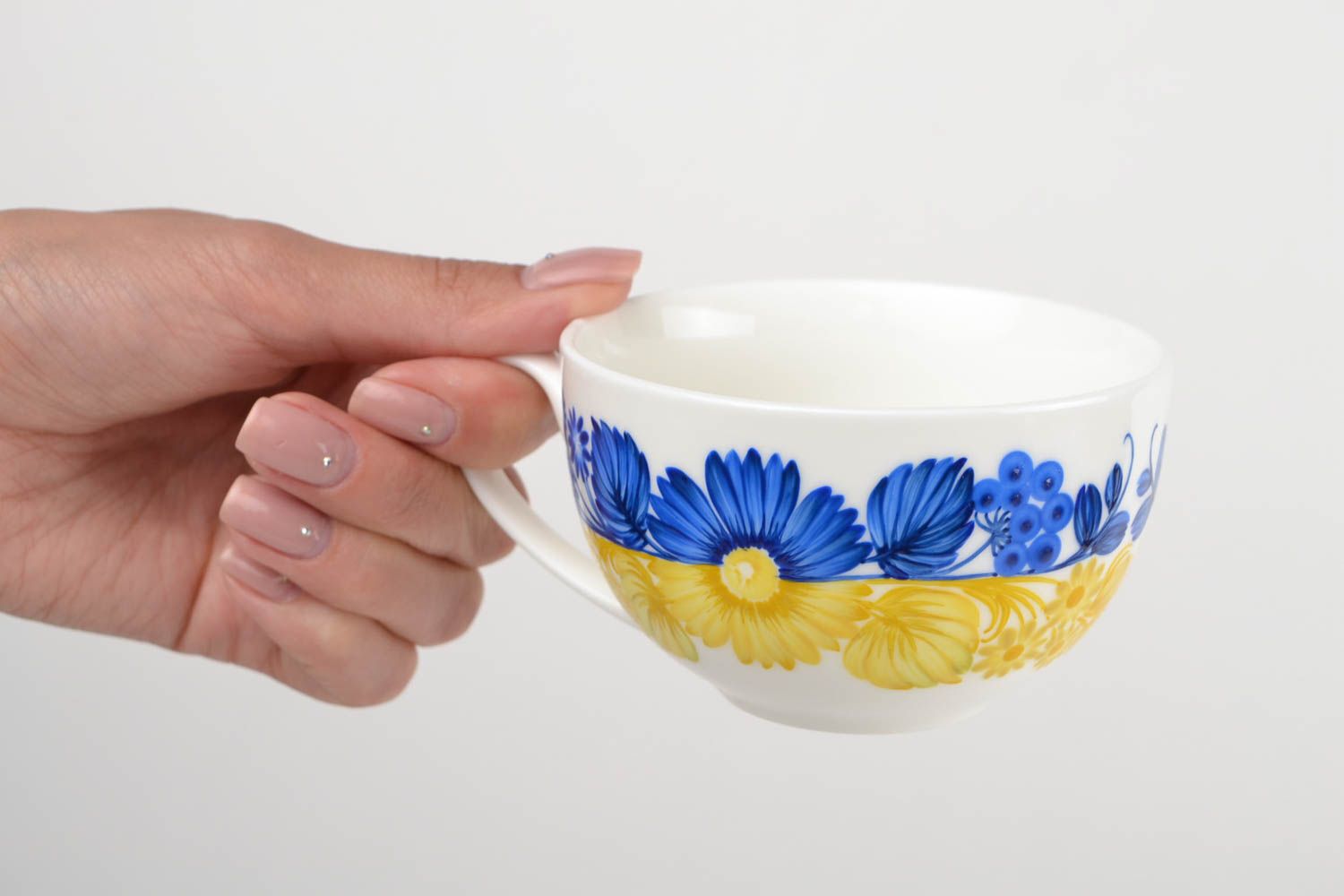 White wide ceramic porcelain cup in blue and yellow color with handle photo 2