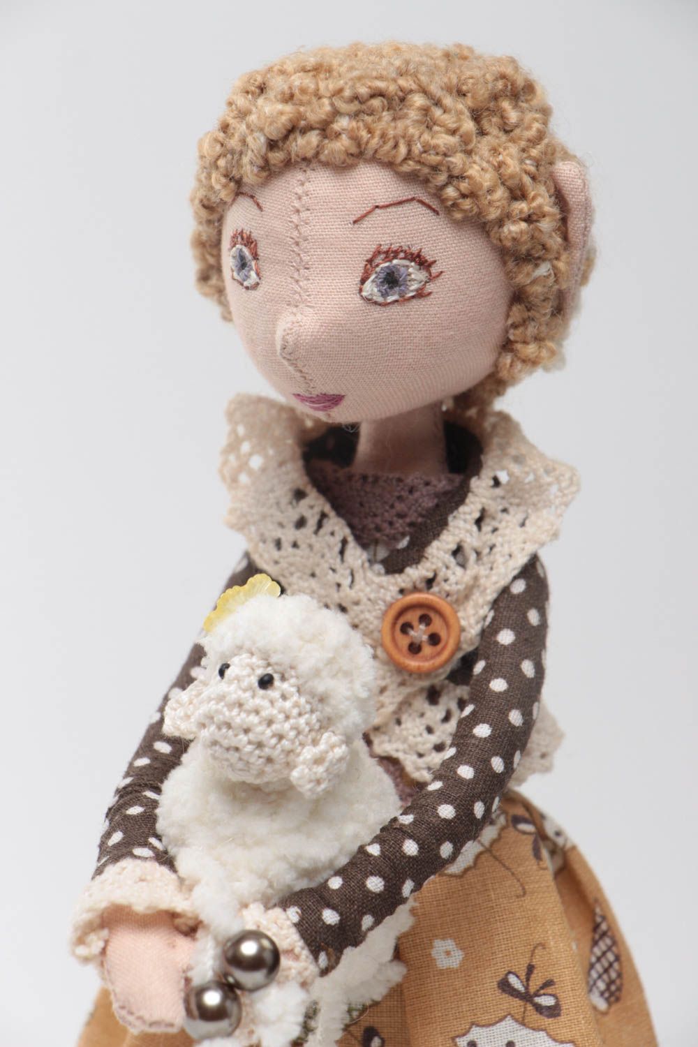 Handmade designer fabric soft doll in brown dress with toy lamb on stand photo 3