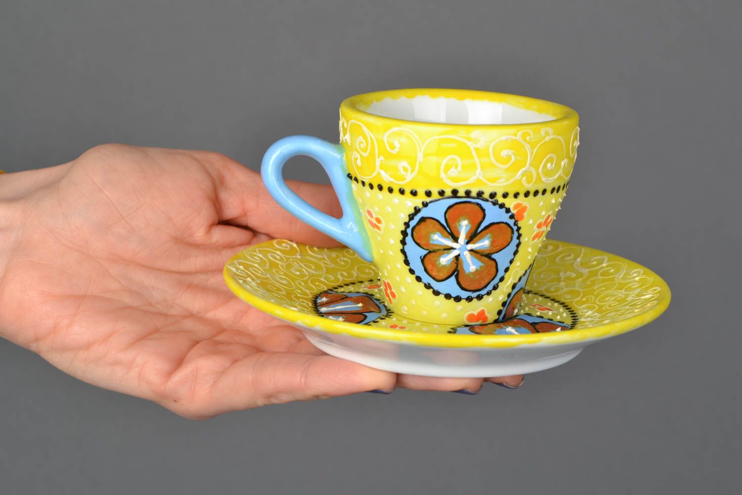 Small 2 oz yellow hand-painted coffee cup with blue handle and flower pattern photo 2