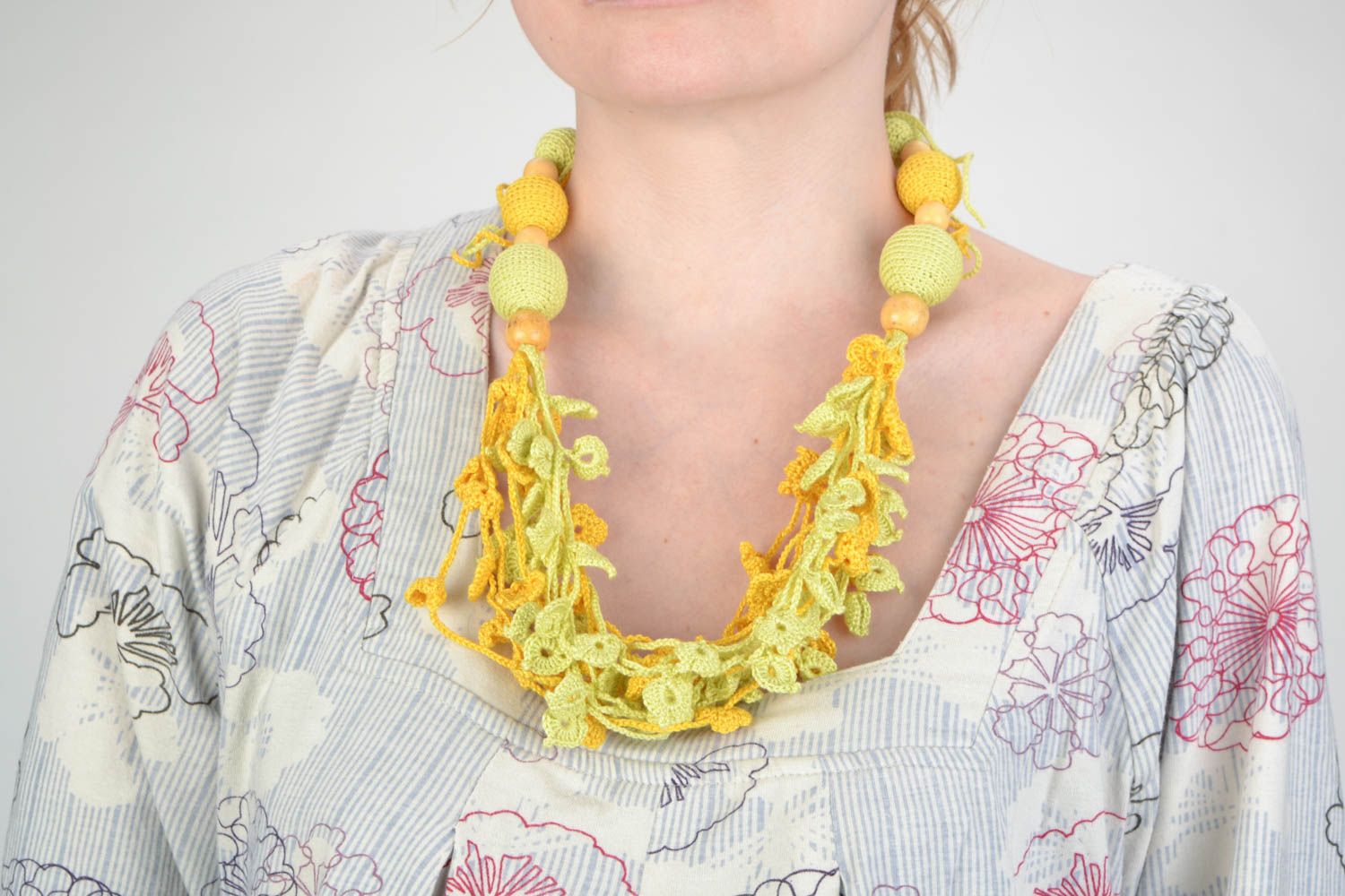Handmade yellow bead necklace crocheted over with cotton threads with ties photo 1