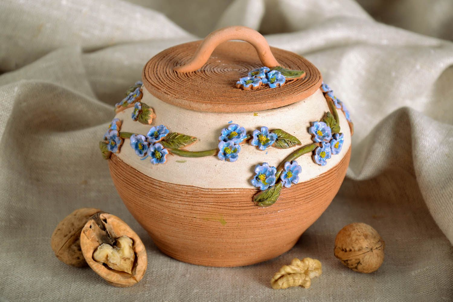 Small clay pot with a lid