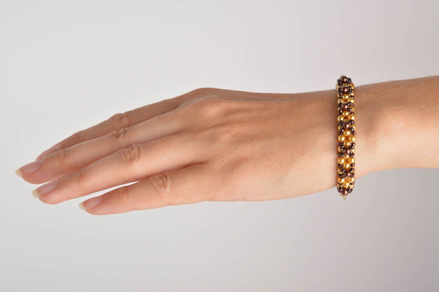 Handmade beaded bracelet in golden and brown color for girls photo 5
