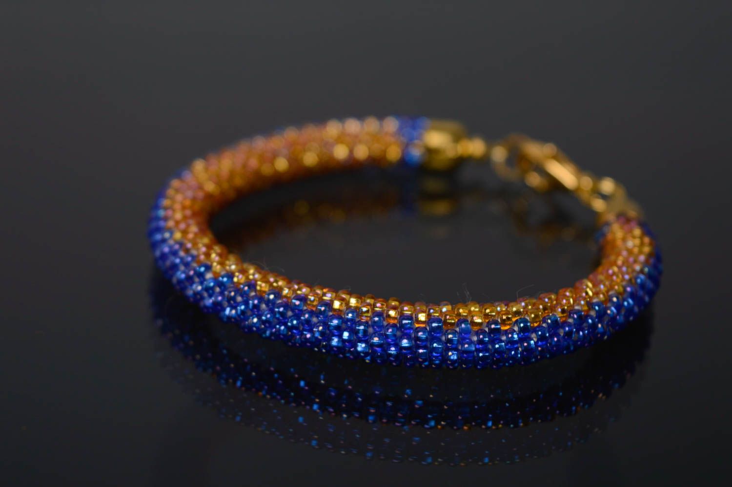 Handmade blue and gold color beads adjustable cord bracelet for women photo 1