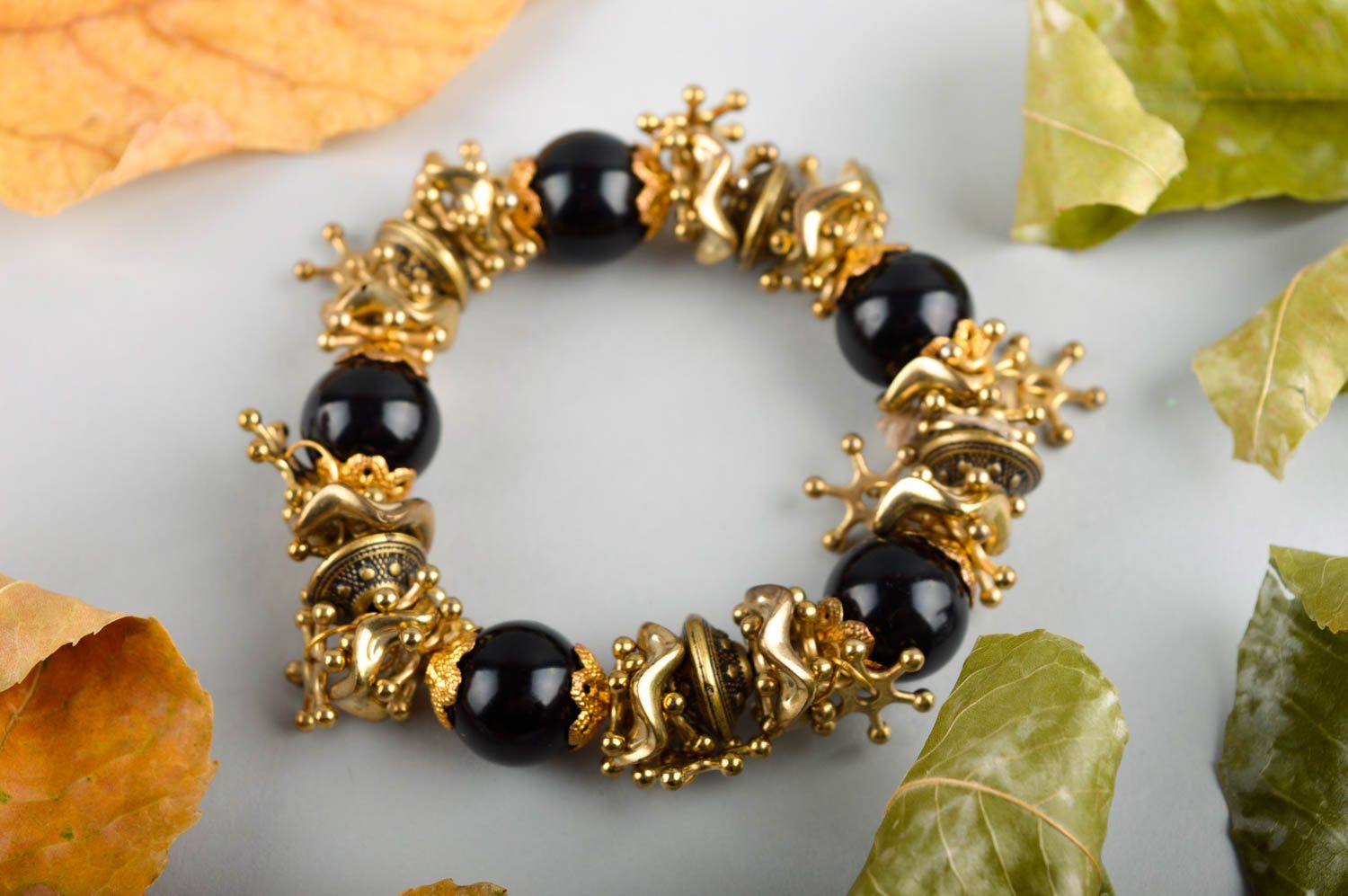 Elastic stretchy bracelet with black beads and golden color charms for teen girl photo 1