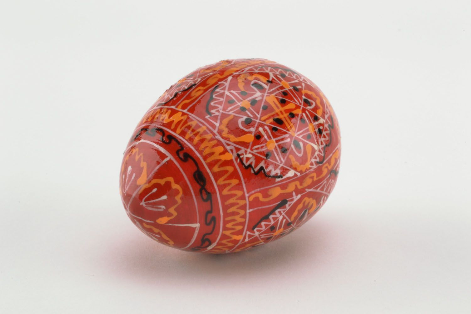 Wooden egg in red colors photo 3