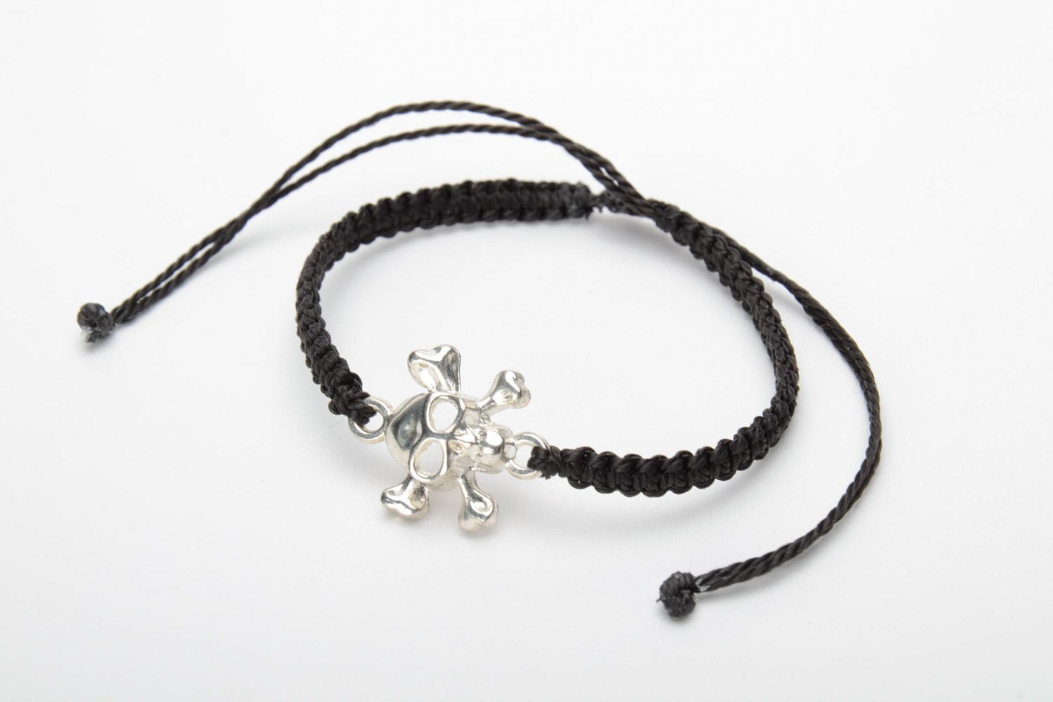 Handmade black woven capron thread wrist bracelet with metal charm in the shape of skull photo 3