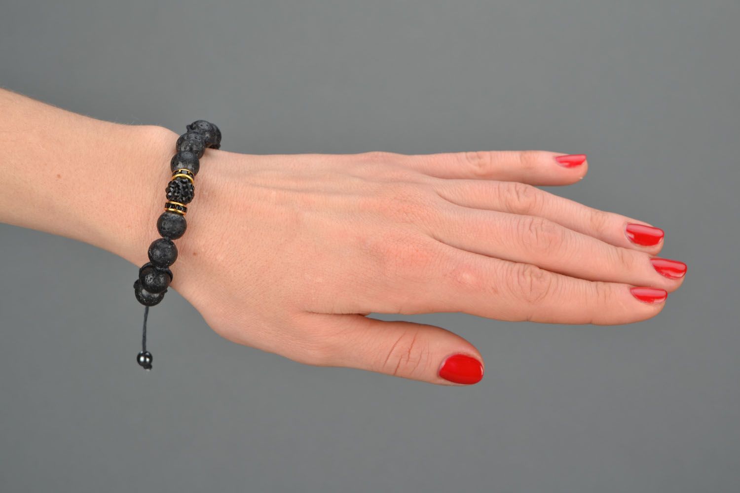 Handmade bracelet with volcanic lava beads photo 1