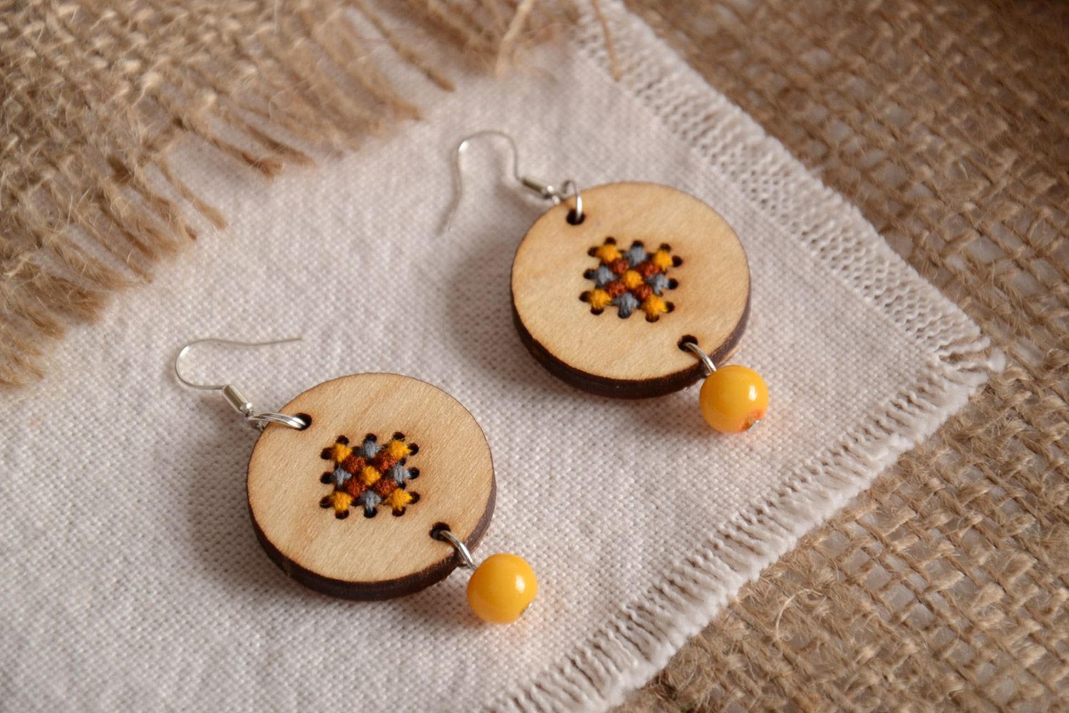Handmade round plywood earrings with cross-stitch embroidery in eco style photo 1