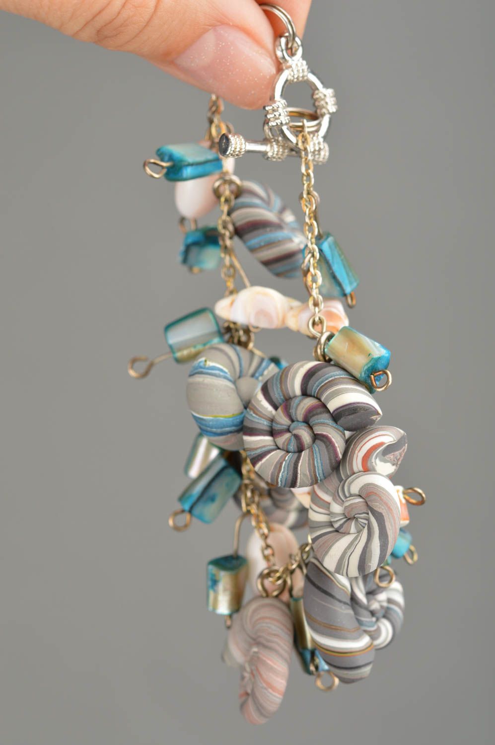 Handmade bracelet made of polymer clay on chain decorated with striped shells photo 2