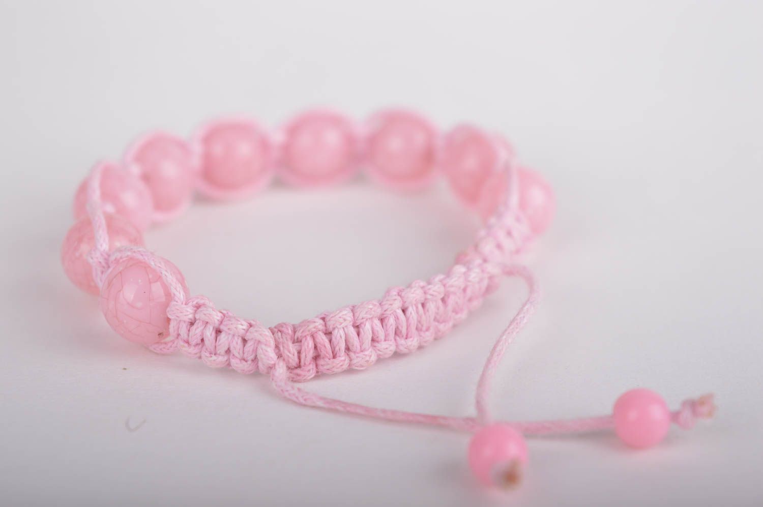 Light pink strand bracelet with pink cord and pink beads photo 4