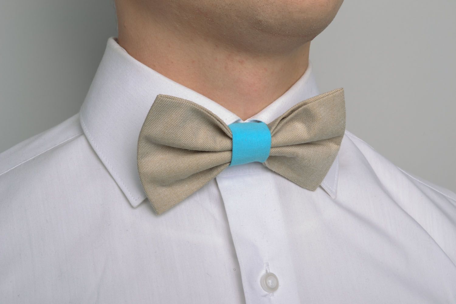 Beige and blue bow tie photo 1