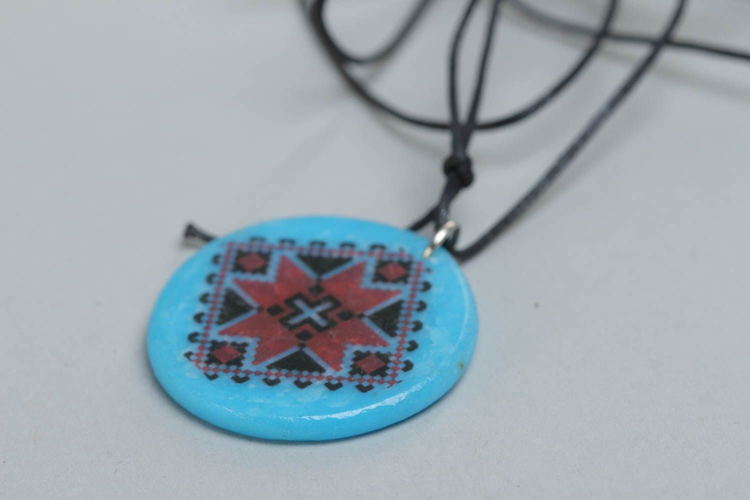Handmade designer pendant with Ukrainian symbols round blue accessory on cord  photo 3