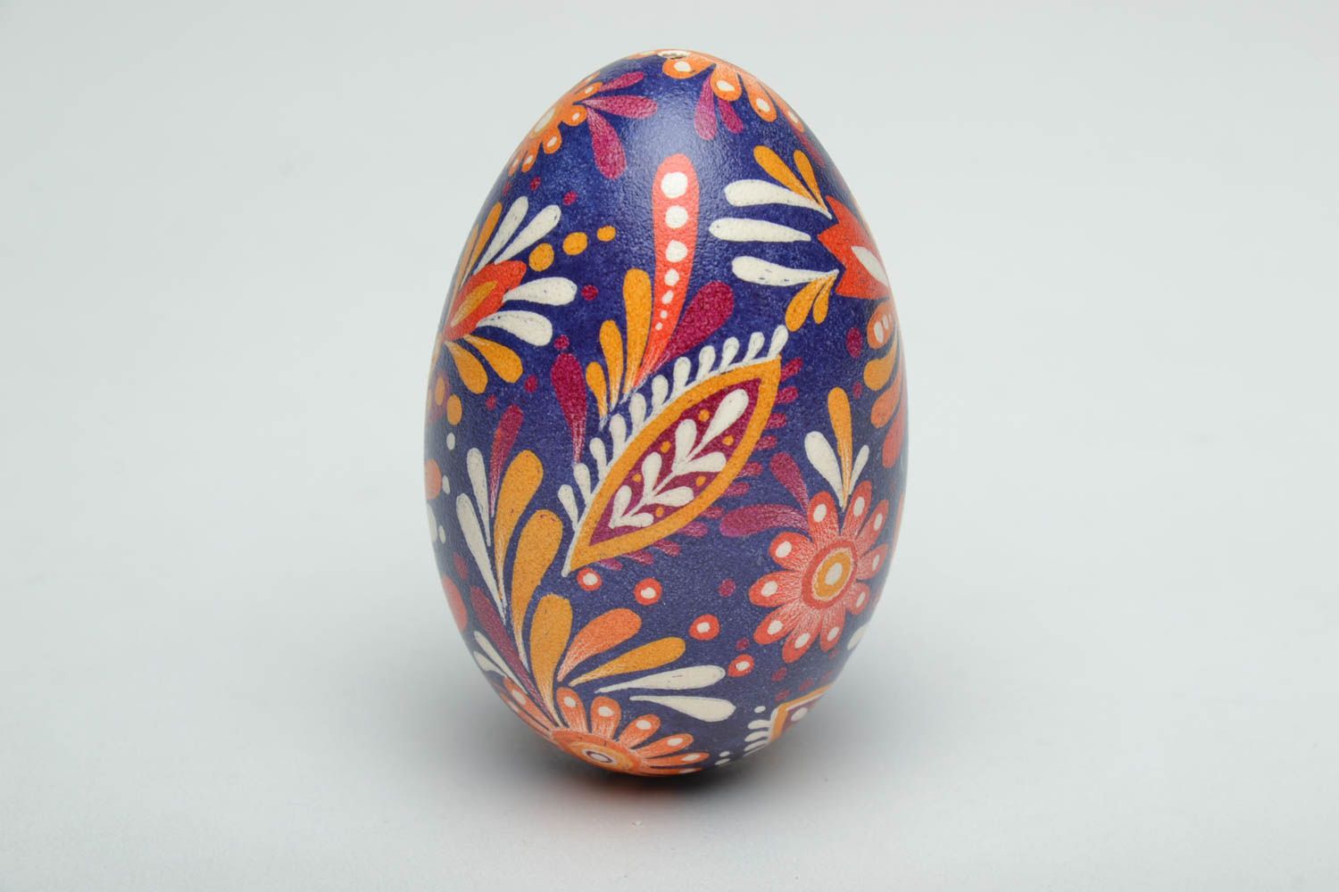 Easter egg painted with floral motives using wax technique photo 3