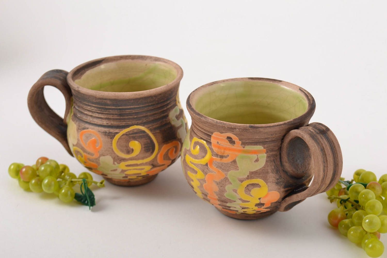 Set of 2two ceramic clay cups with light green glaze inside with handle and hand-painted pattern photo 1