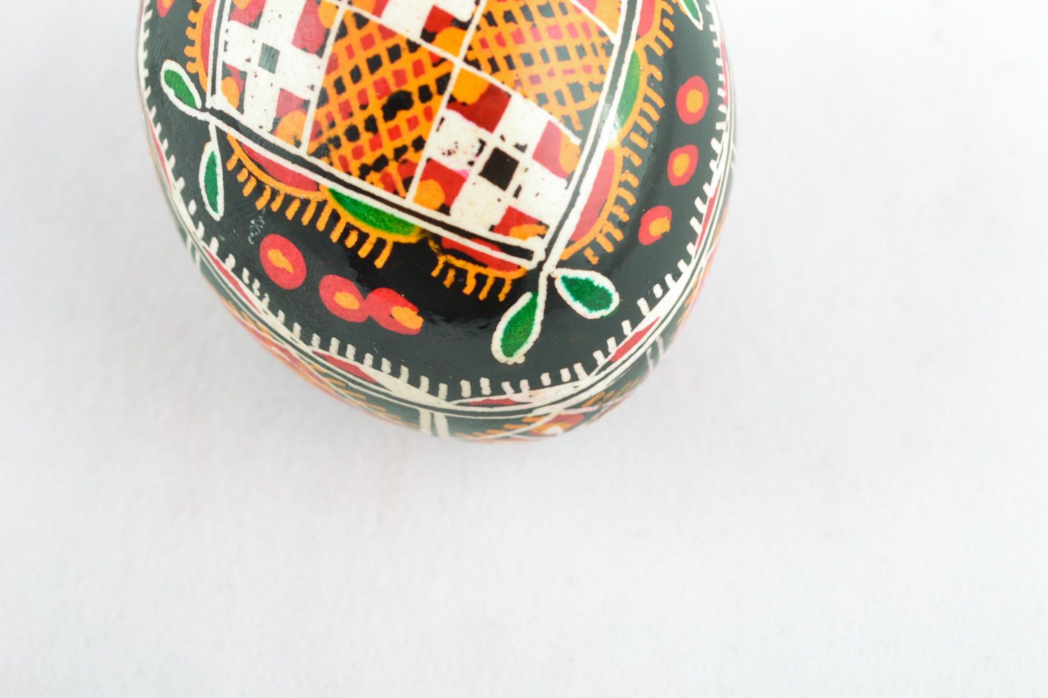 Homemade ornamented Easter egg pysanka with traditional painting made with hot wax photo 3