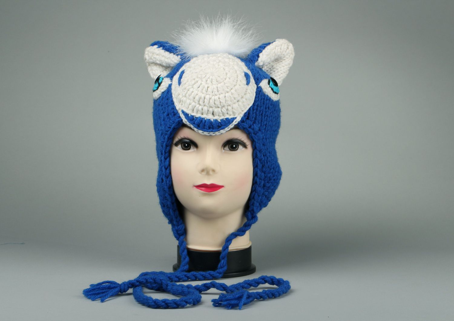 Knitted earflap made of semi-wool with artificial fur photo 2