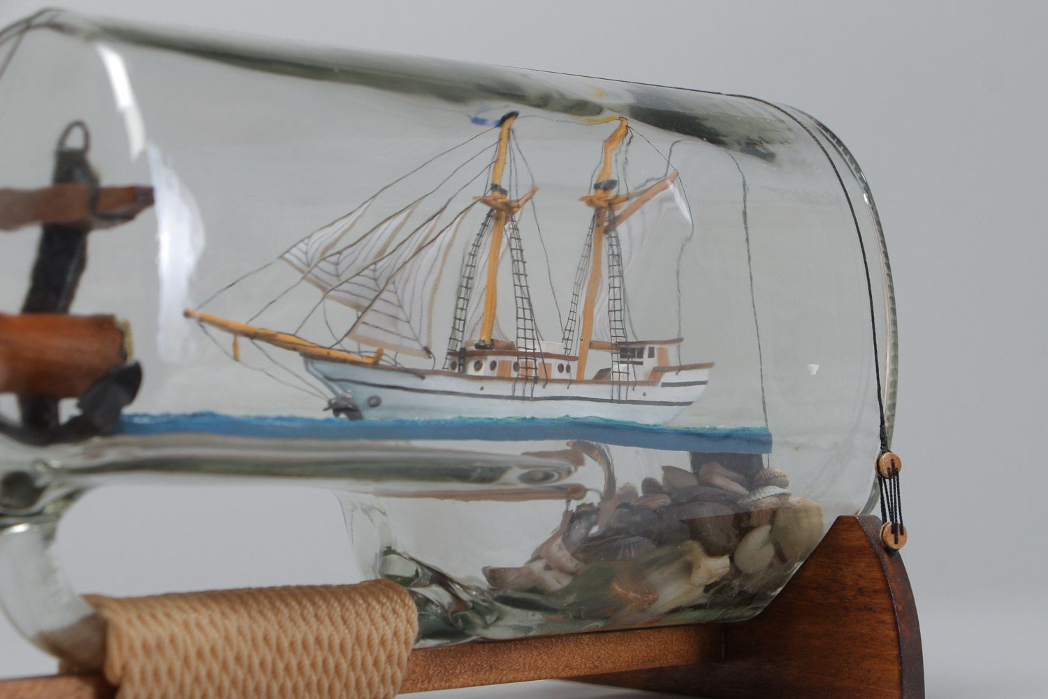 Handmade beautiful composition the ship in a glass bottle in marine style photo 3
