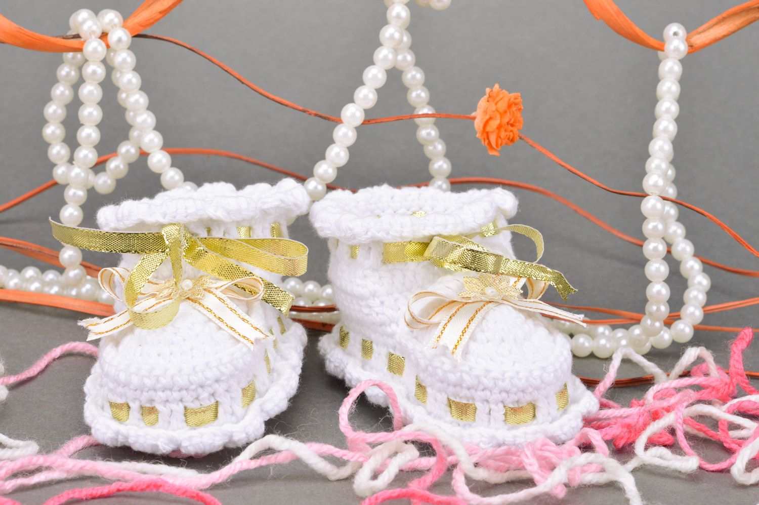 Handmade small summer white baby booties for a girl with golden ribbons photo 1
