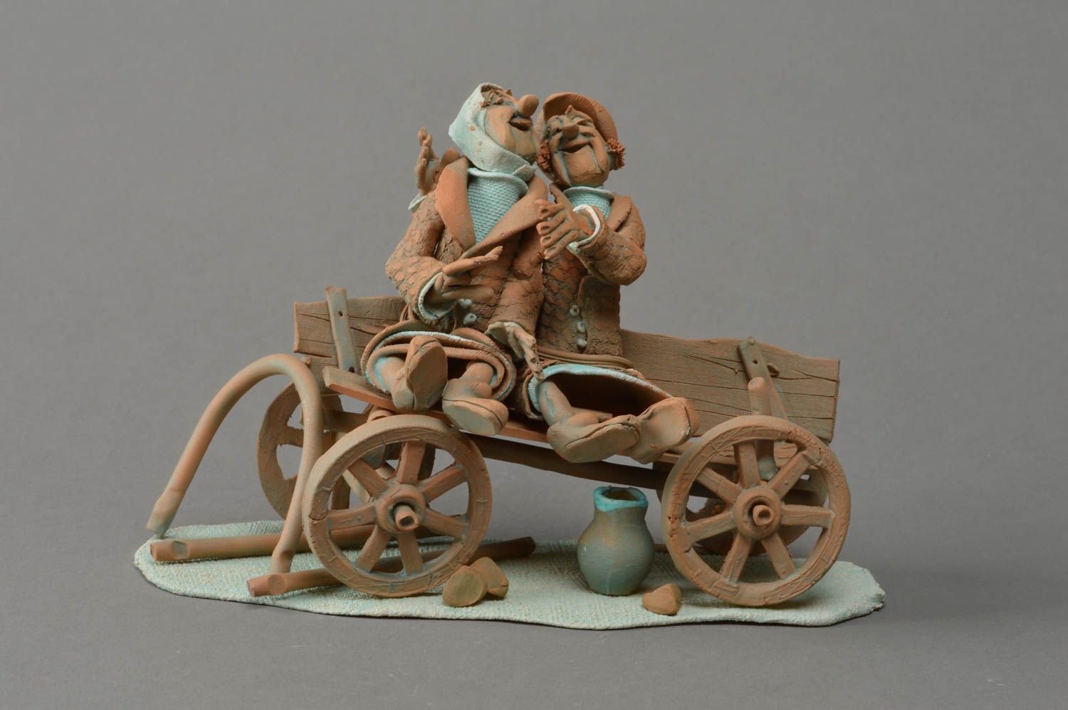 Handmade decorative unusual clay figurine Cheerful Couple in Cart photo 1