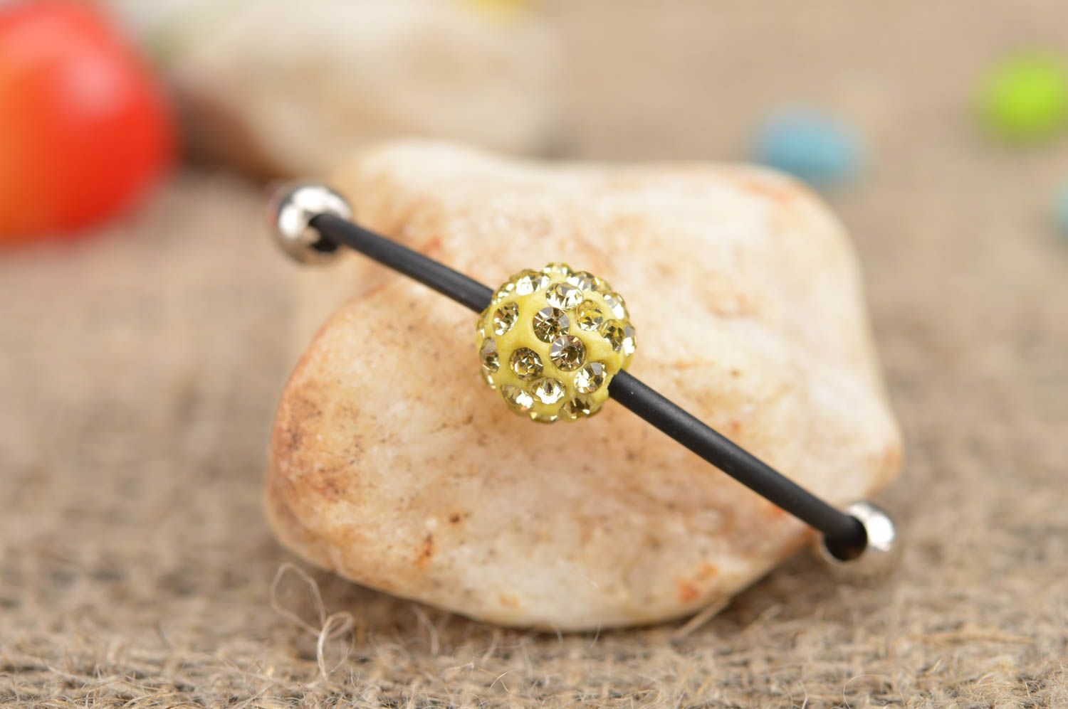 Simple handmade female bracelet made of rubber lace with bead Yellow ball photo 1
