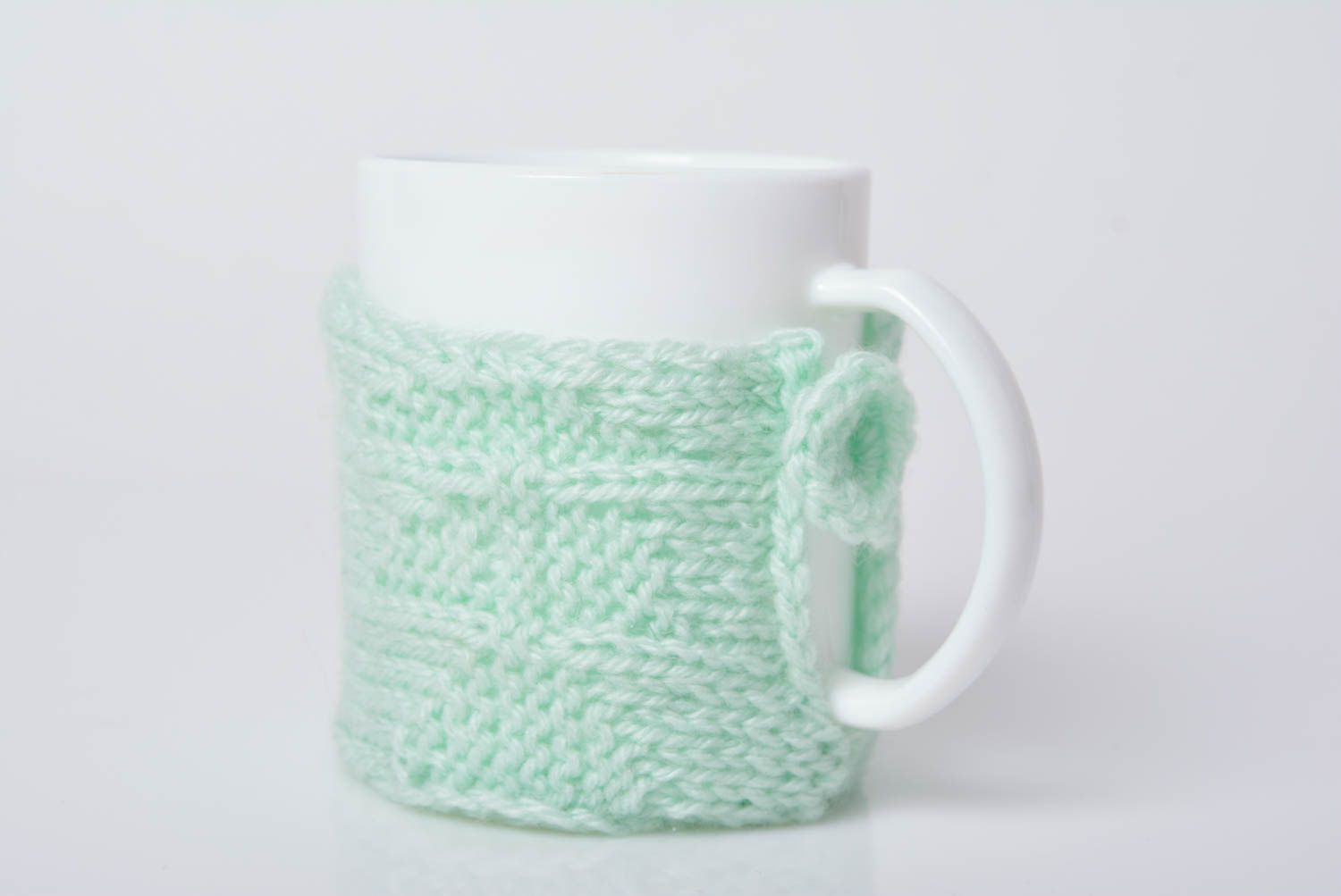Handmade crocheted beautiful case for cup made of acrylic yarns of mint color photo 1