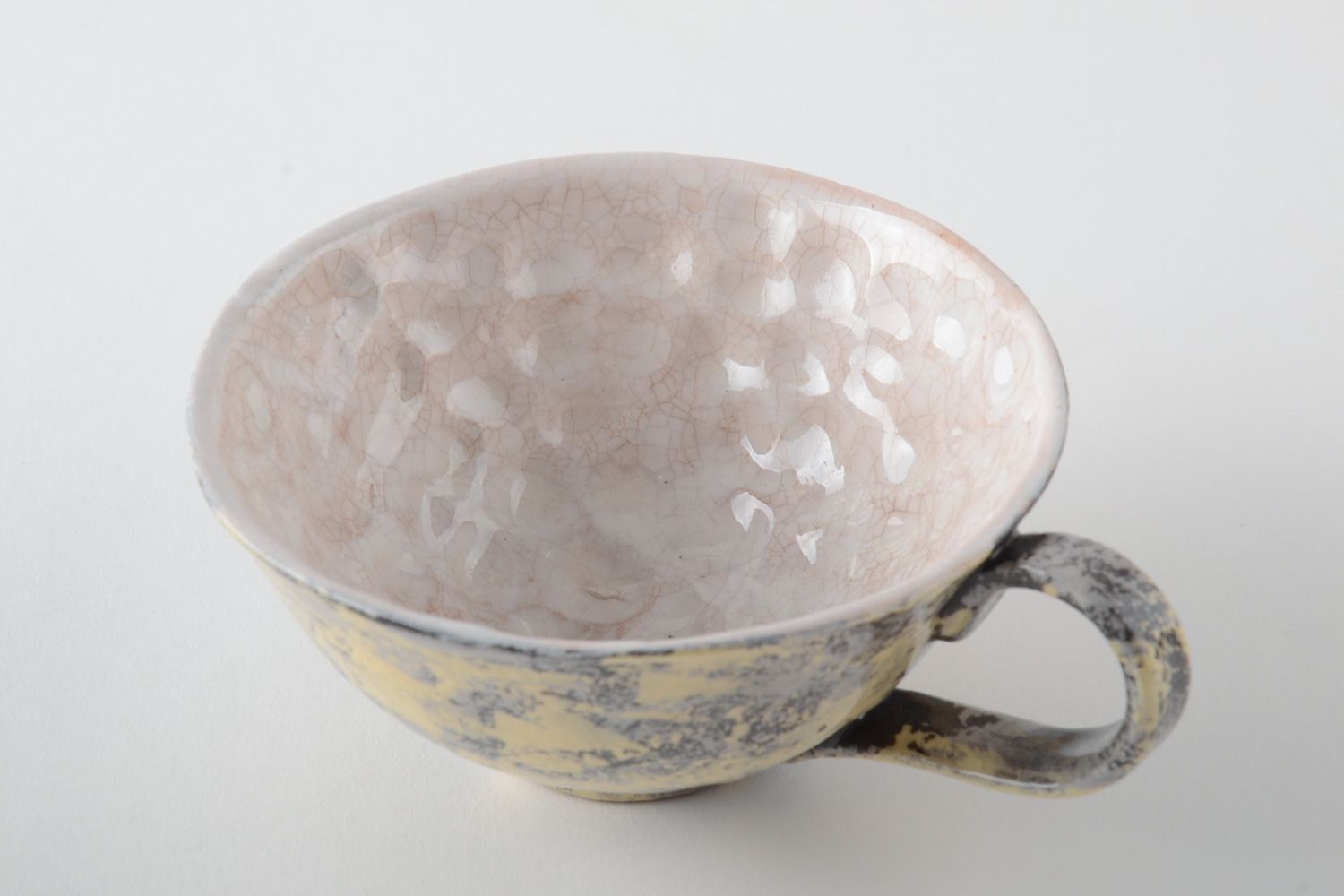 Glazed ceramic cup in beige and brown color with the handle photo 3