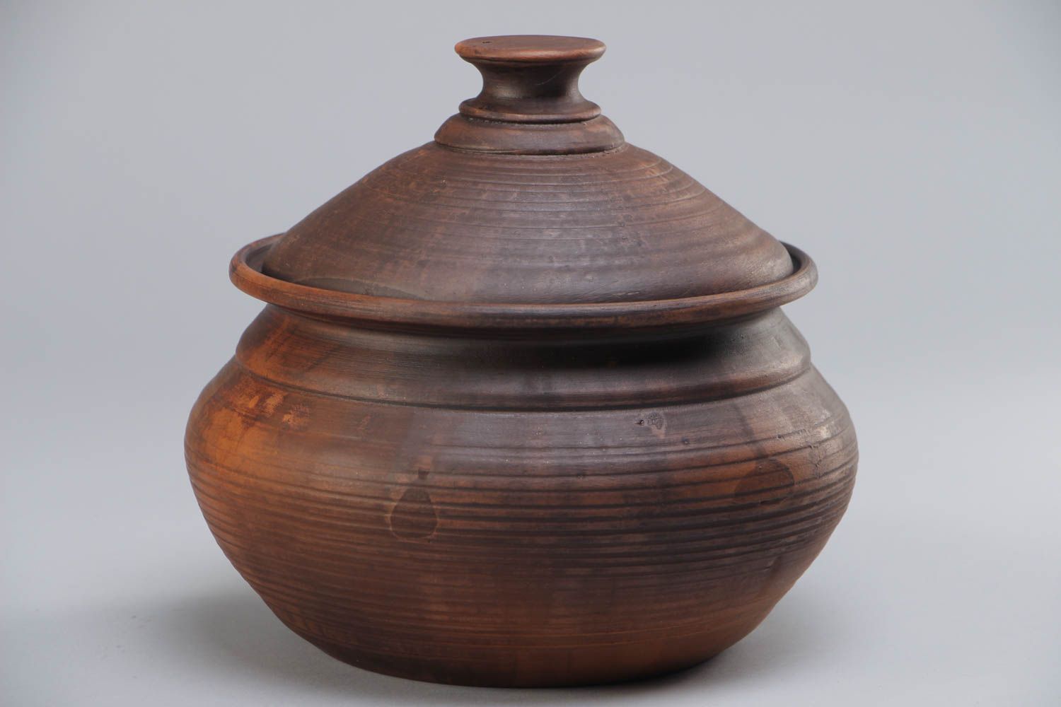 Handmade dark brown ceramic pot with lid for baking kilned with the use of milk photo 2