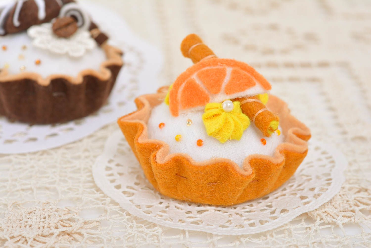 Handmade designer decorative soft pincushion sewn of felt bright orange cake photo 2