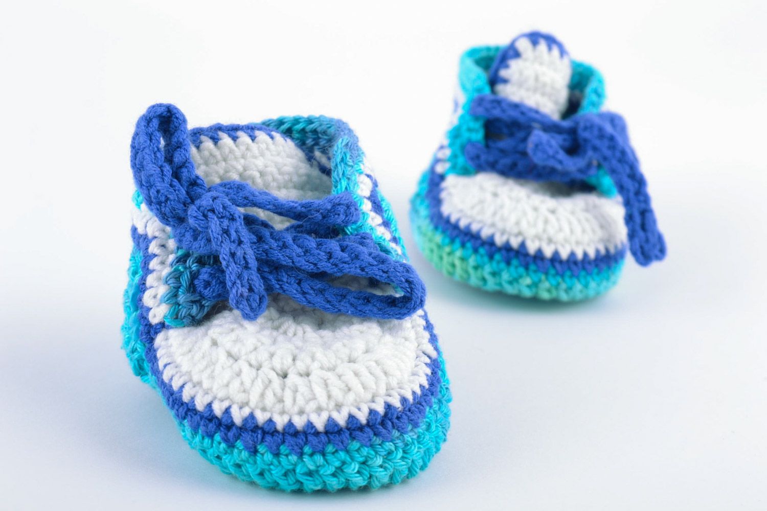 Handmade knitted wool baby booties in blue color palette photo 5