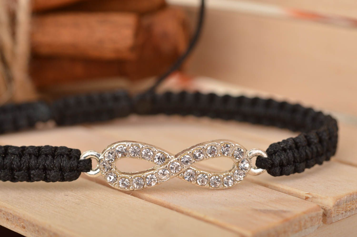 Handmade cute thin black woven wrist bracelet made of silk with insert photo 1