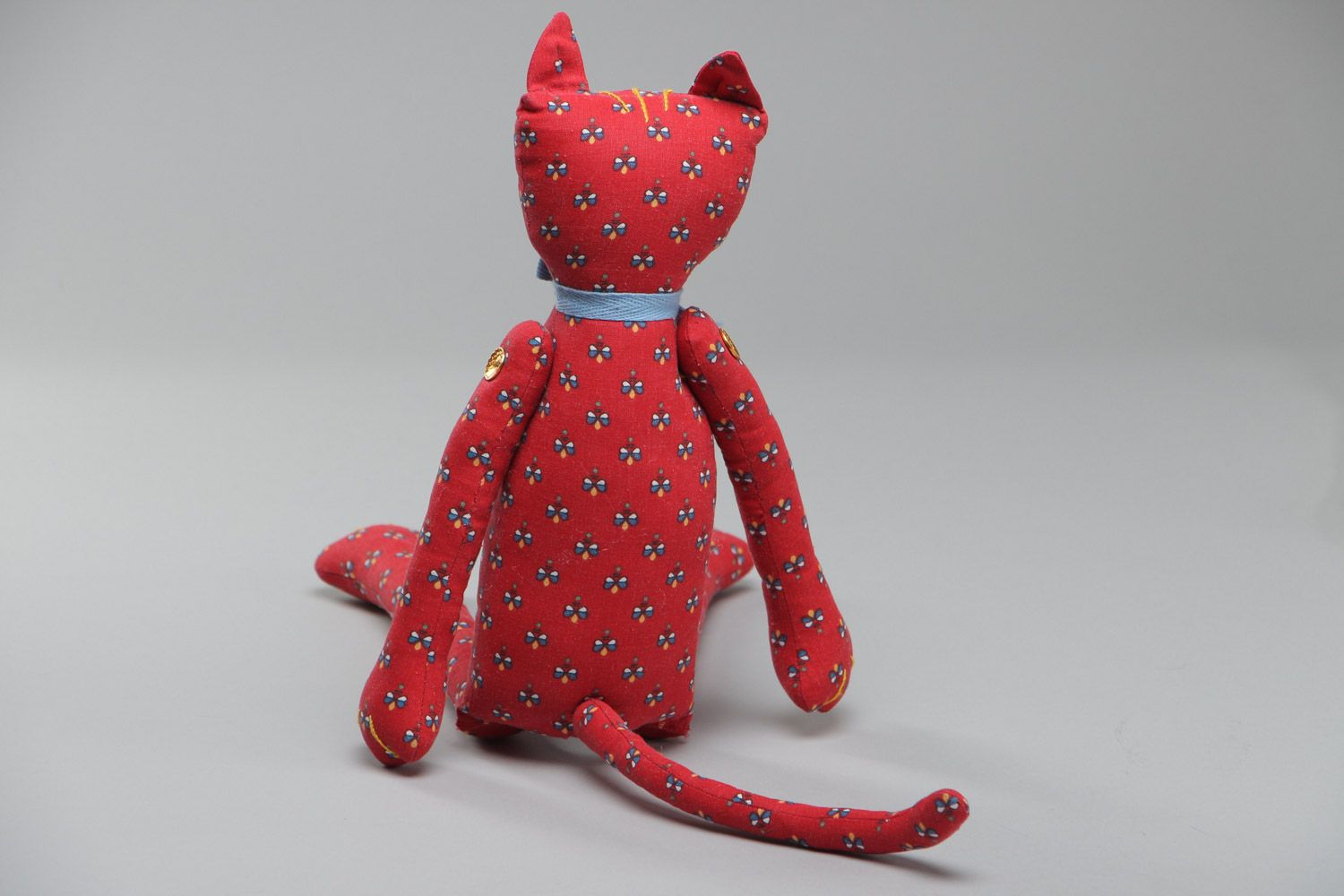 Beautiful homemade soft toy sewn of red fabric with floral pattern Cat with bow photo 4