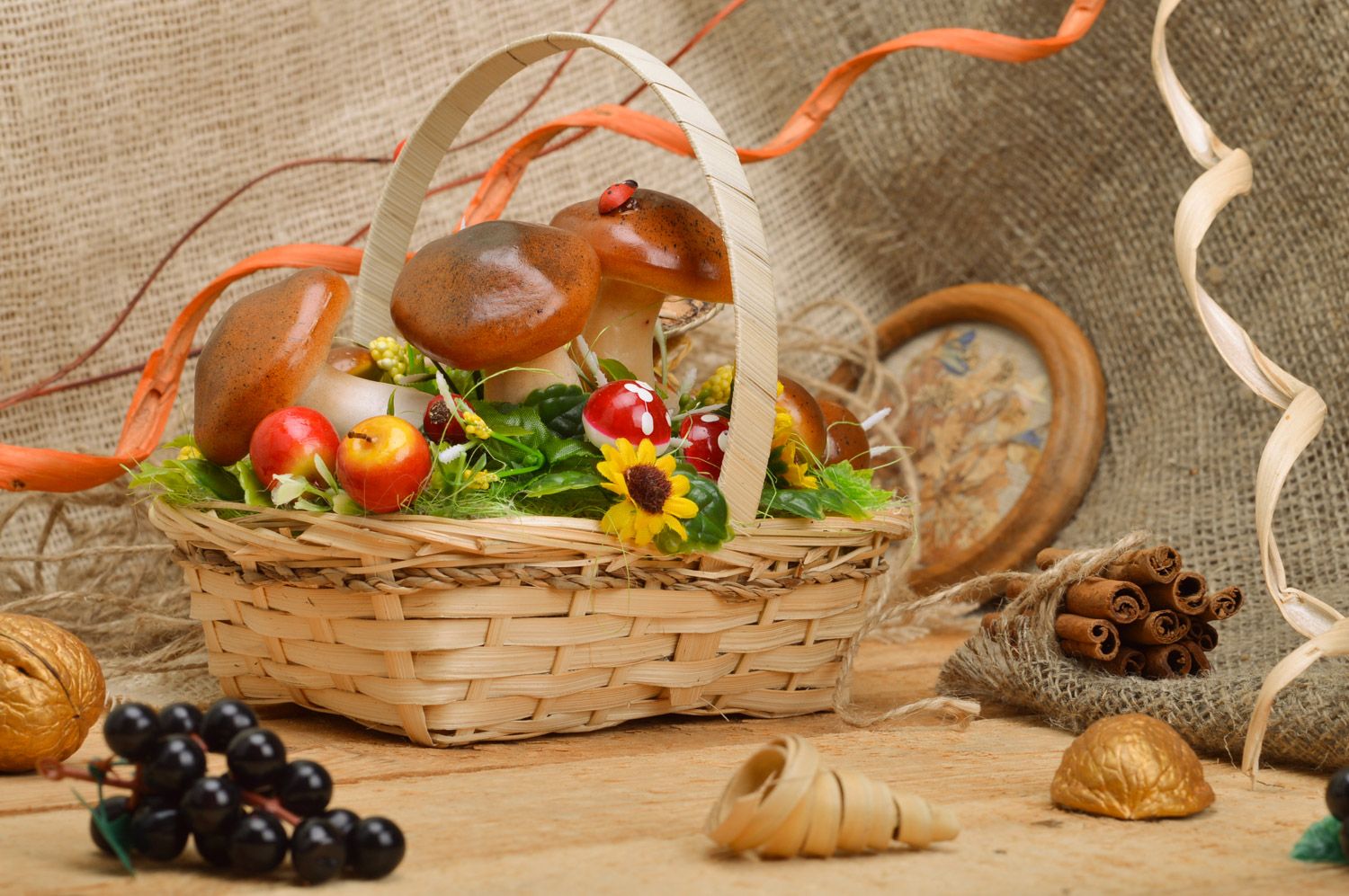 Handmade decorative sisal basket with fruit and mushrooms and frog figurine interior composition photo 1