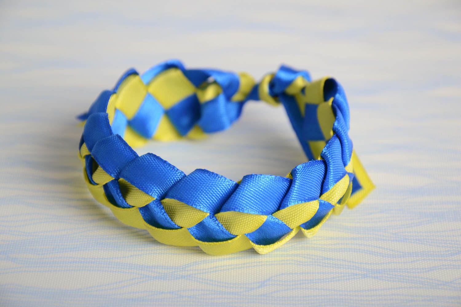 Handmade bright wrist bracelet woven of yellow and blue satin ribbons photo 1