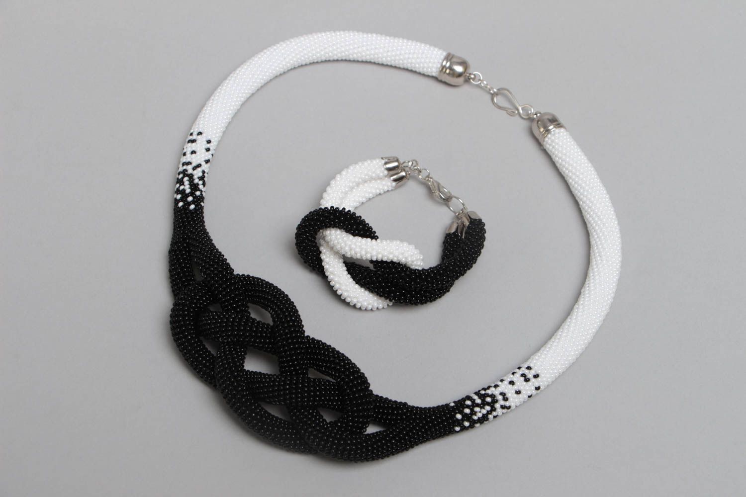 Beaded jewelry necklace and bracelet in shape of cords black and white beautiful photo 2