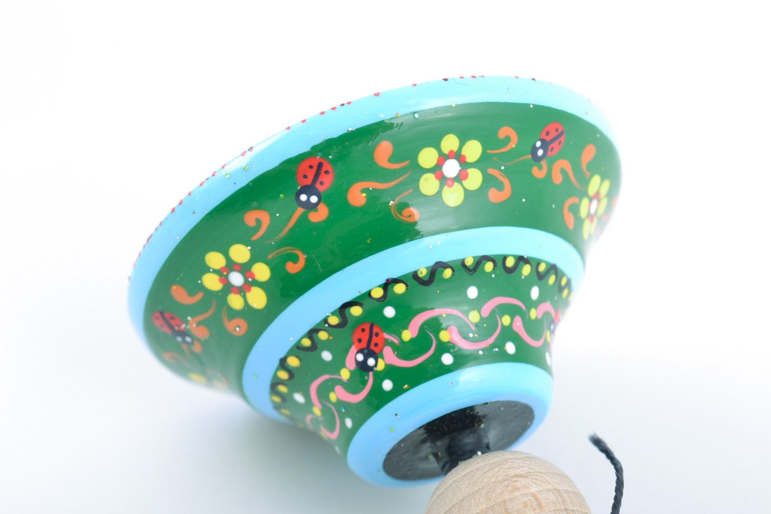 Bright handmade painted wooden toy spinning top with ring for children's fine motor skills photo 3