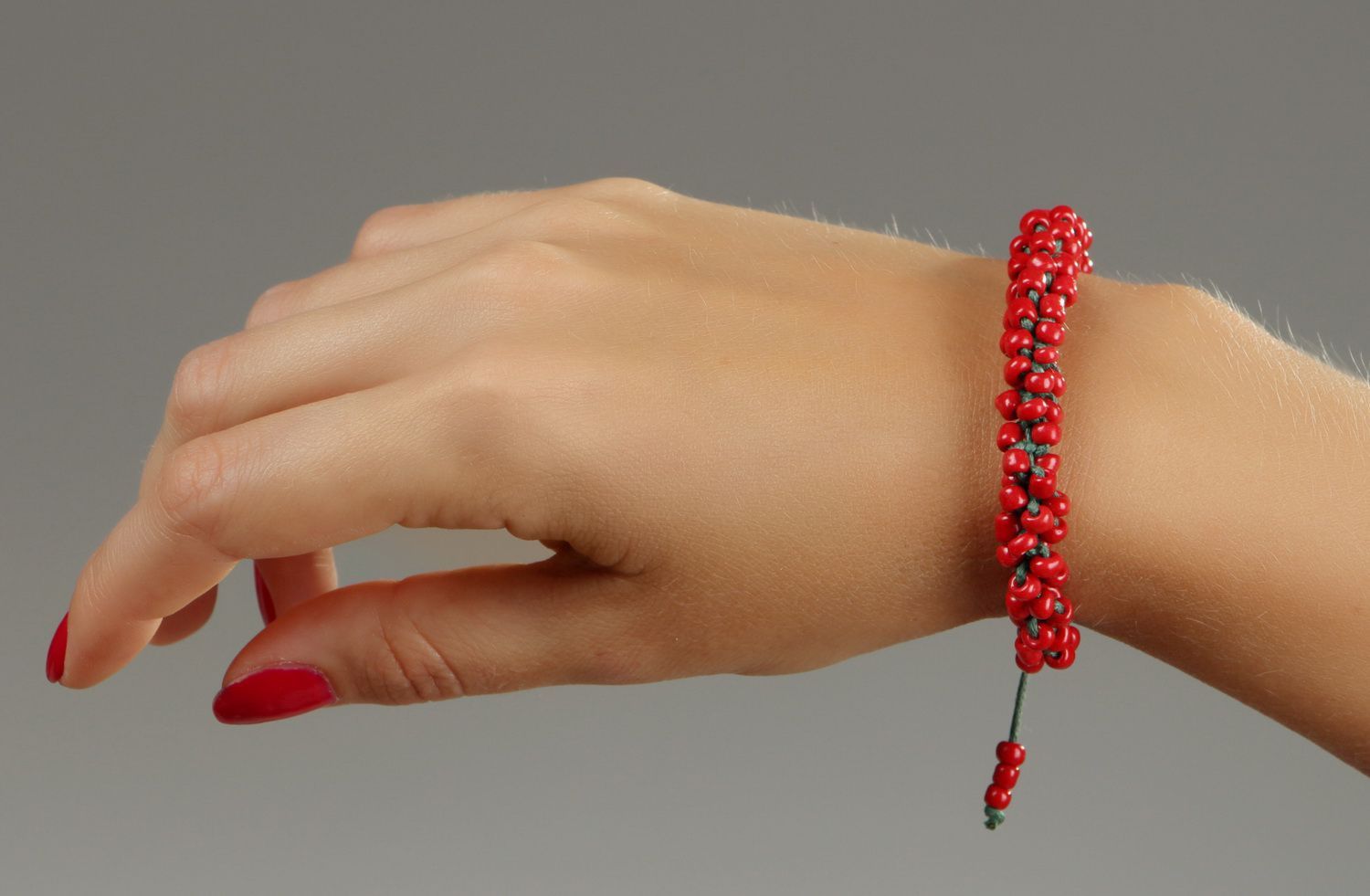 Red bracelet with beads photo 4