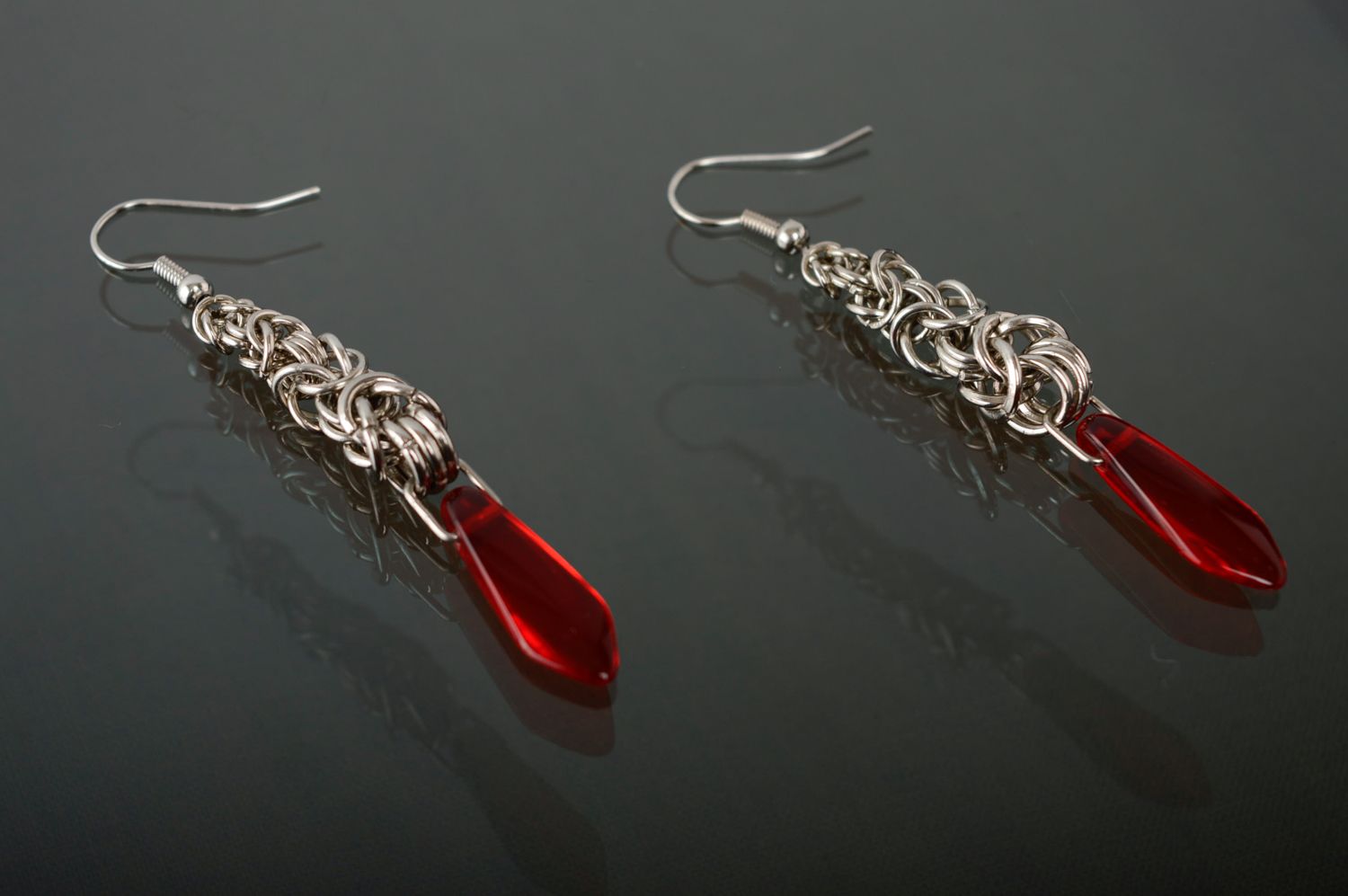 Long metal earrings with red beads made using chain armor weaving technique photo 2