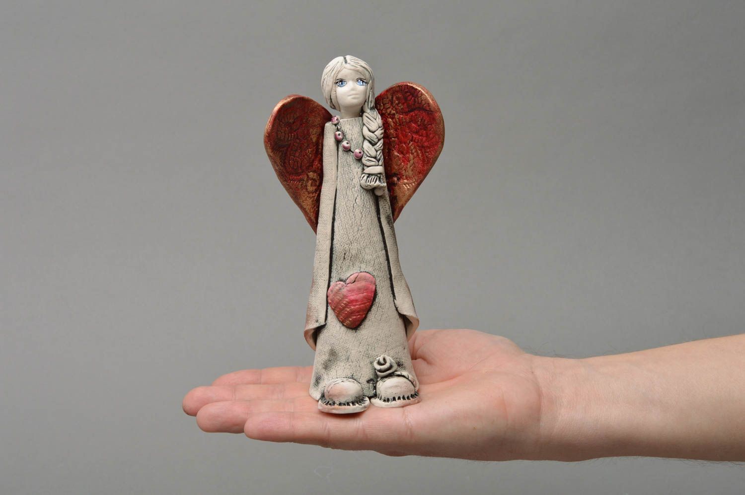 Handmade decorative souvenir statuette made of porcelain Angel with plait photo 4