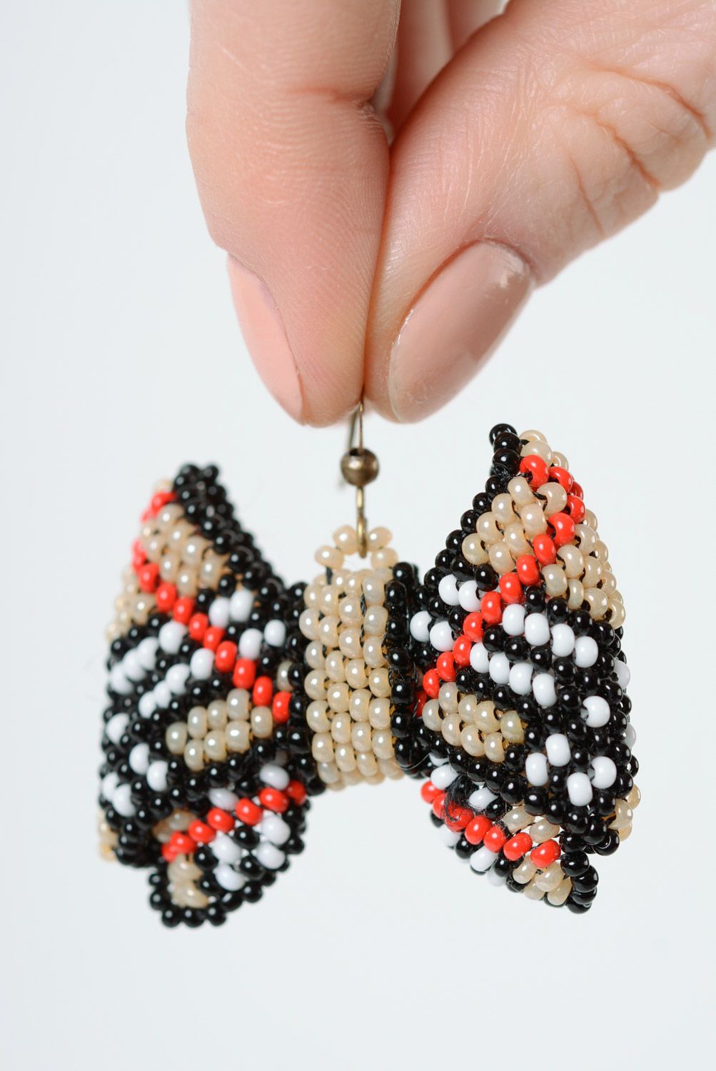 Handmade dangle earrings woven of beads beige checkered bows for girls photo 2