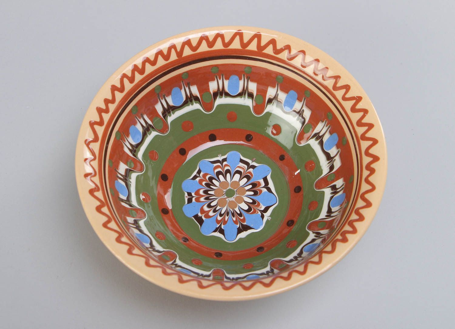 Handmade beautiful deep ceramic bowl ornamented with colorful glaze for 500 ml photo 3