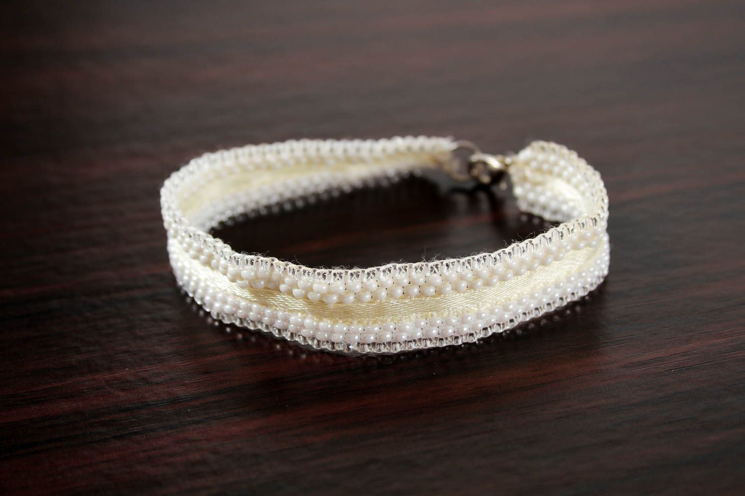 Line bracelet with white beads on textile base for girls photo 3