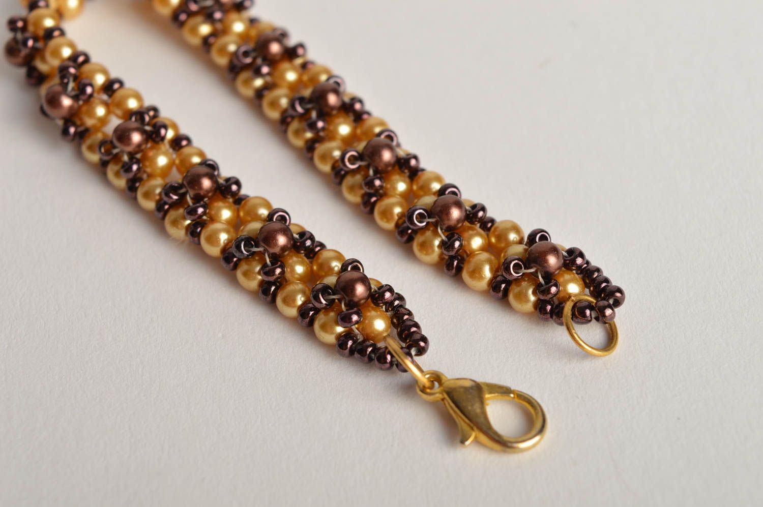 Handmade beaded bracelet in golden and brown color for girls photo 3