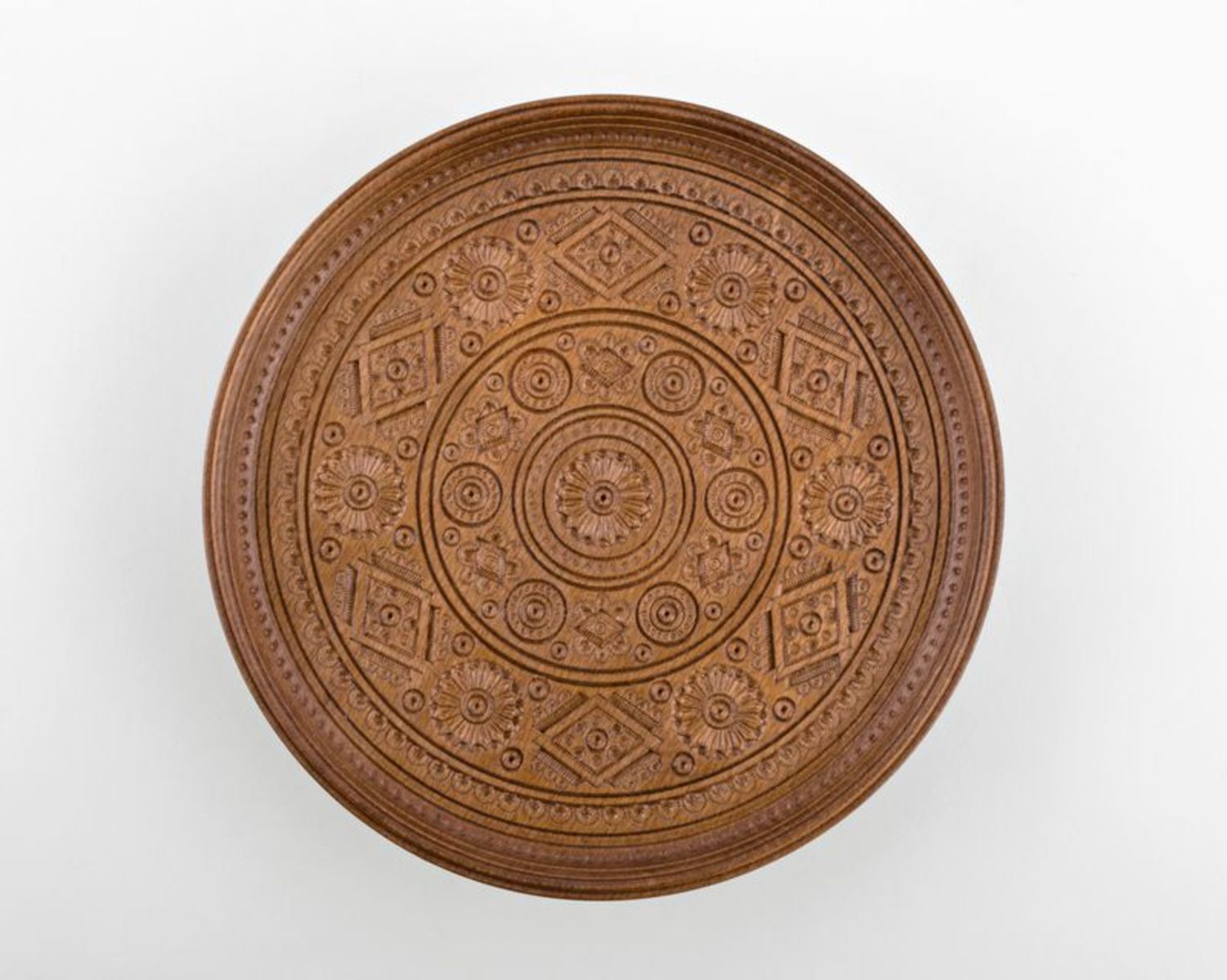 Wooden fruit bowl with carving  photo 2