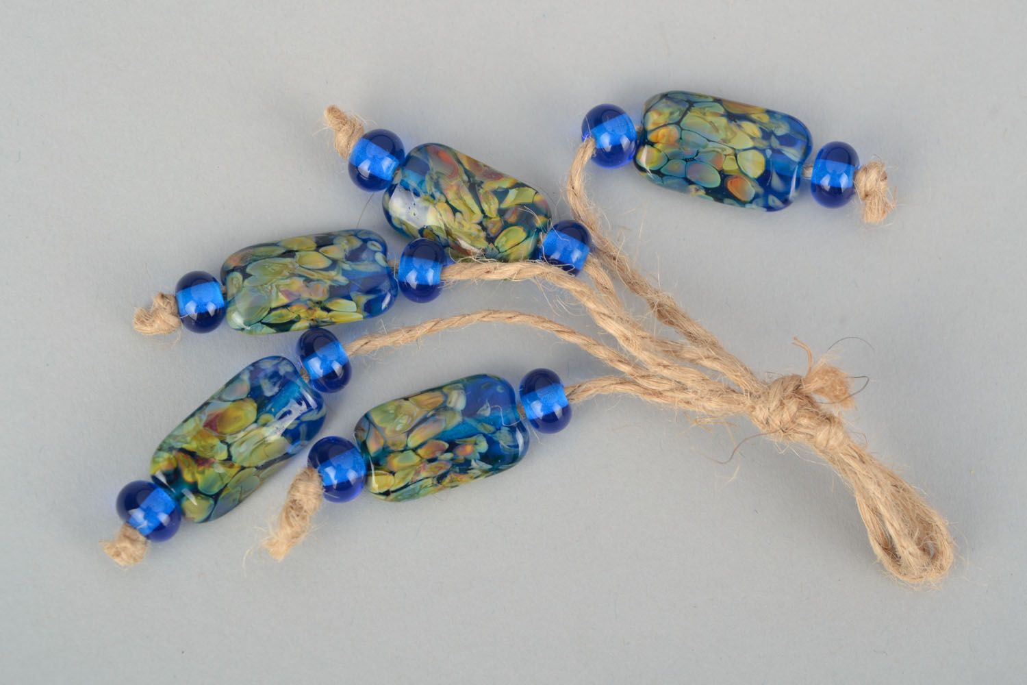 Ensemble de perles bleues à motif en verre au chalumeau  photo 1