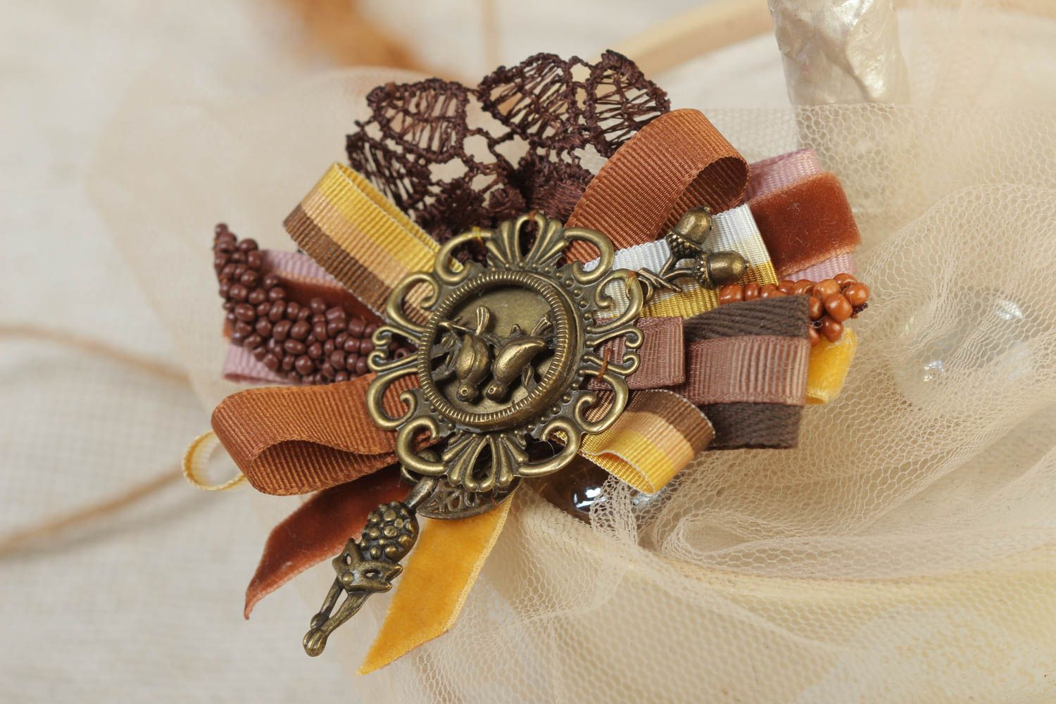 Handmade rep ribbon brooch with lace and charms in brown color palette photo 1