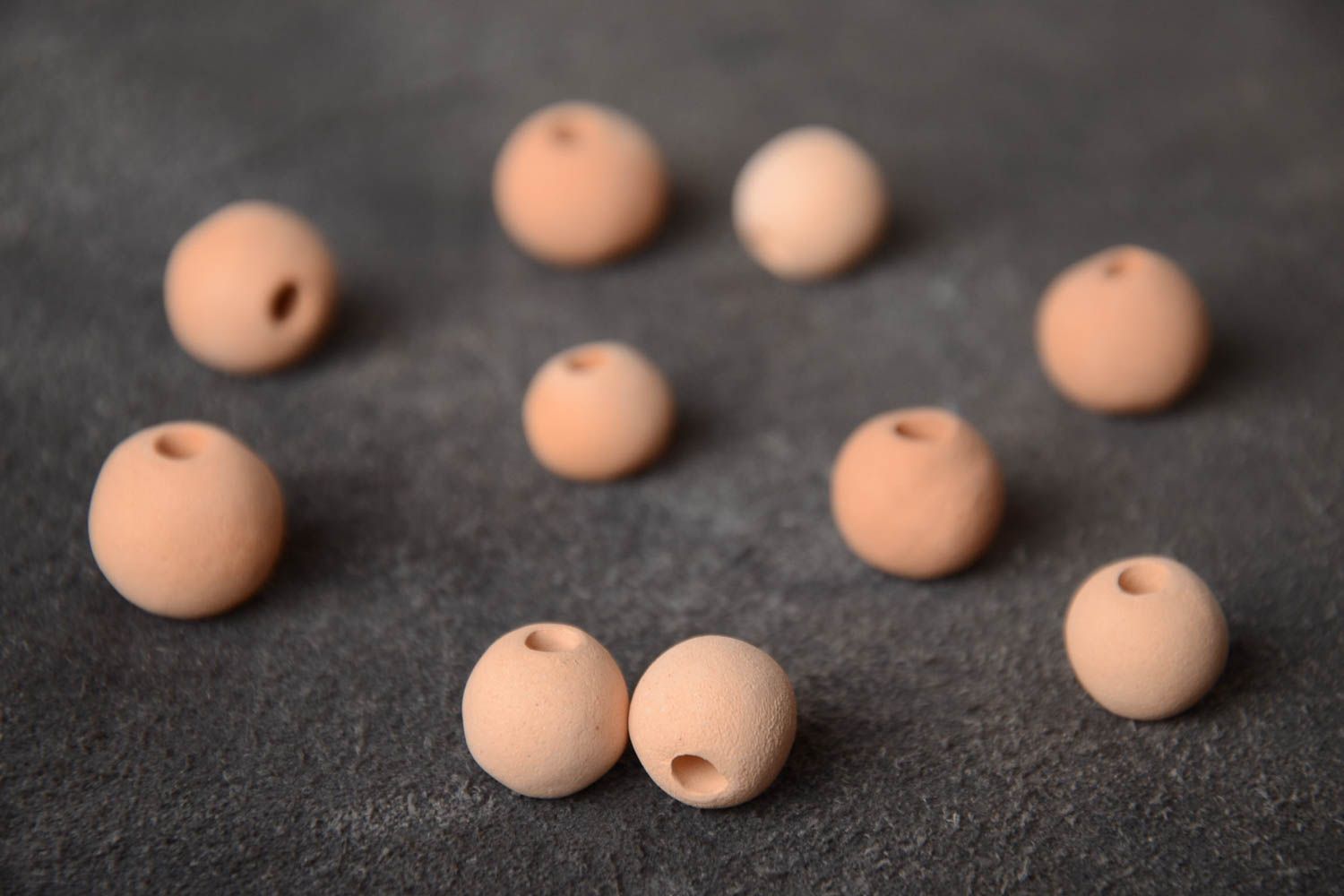 Set of 10 small handmade beige ceramic beads with smooth surface photo 1